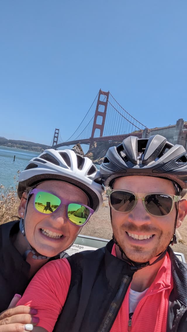 Pat and Kerrianne cycling near the Golden Gate Bridge